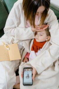 mother child has fever telemed doctor on phone