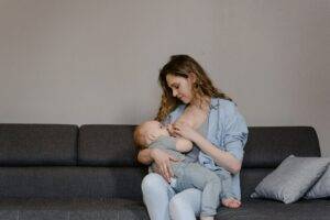 newborn-baby-doctor-mother-breast-feeding-baby