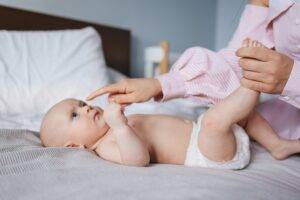 mother and playing with newborn baby