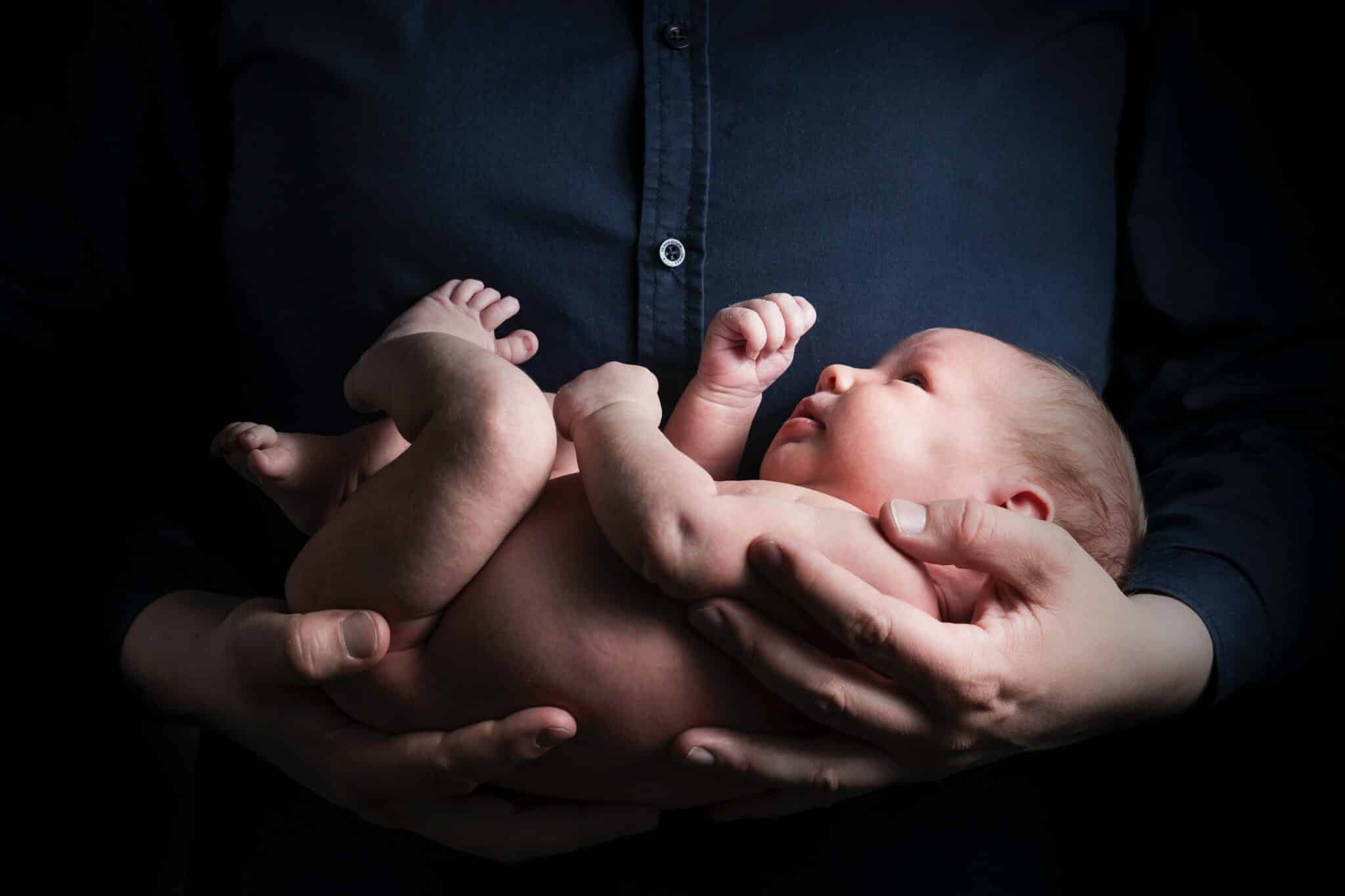newborn baby doctor parent holding her newborn baby 1 scaled