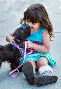 newborn-baby-doctor-adorable-little-girl-playing-with-dog-pet-allergy