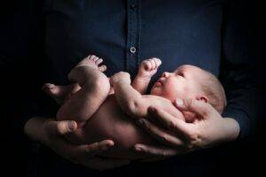 newborn-baby-doctor-parent-holding-her-newborn-baby