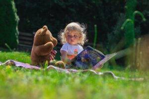 Tips to Prepare Your Child for Preschool 3 lovely little girl holding colorful book