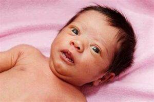 Why Are Some Babies Born With a Full Head of Hair? 1 newborn baby with hair