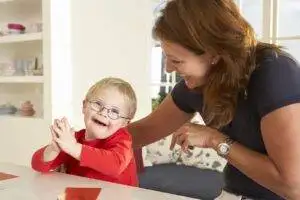 bigstock Downs Syndrome boy having spee 67726507 min