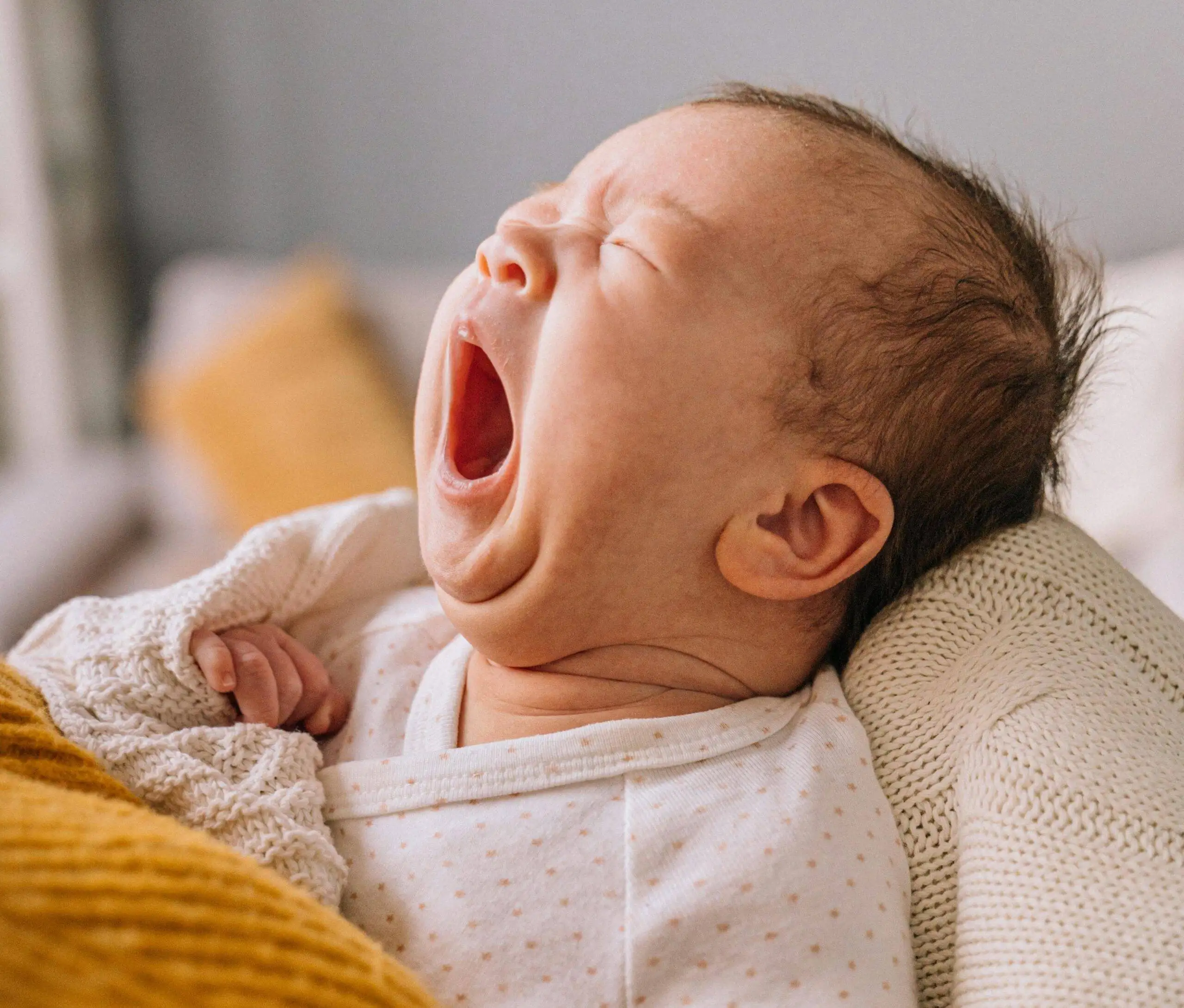 Support Your Baby's Head Lifting: Rolled Blankets or Wedges Can Help in 5 Ways 1 yawn scaled